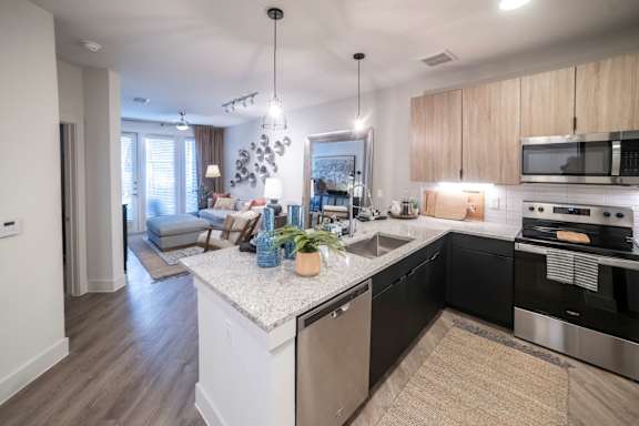 open floorplan kitchen with island and updated appliances