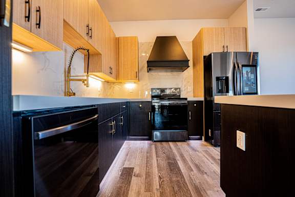 Kitchen with dark wood cabinets at Chelsea Apartments, St Louis