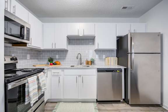 Kitchen with Cabinetry at The Waters at Chenal Apartments, Little Rock, AR, 72211