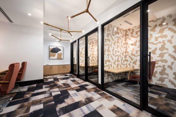 a conference room with a checkered floor and glass doors
