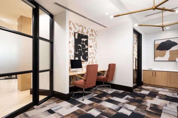 a conference room with a desk and chairs and a checkered floor