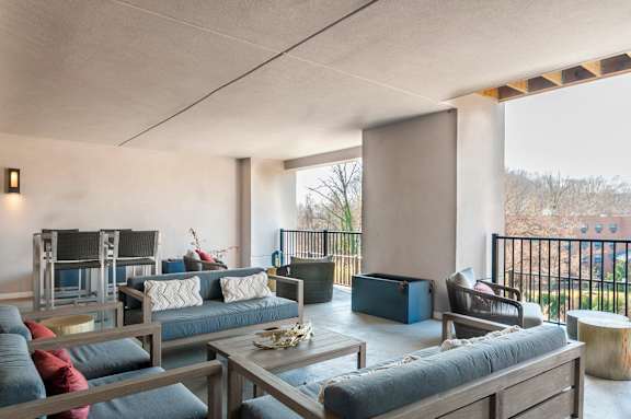 A modern living room with a large sofa and a coffee table.