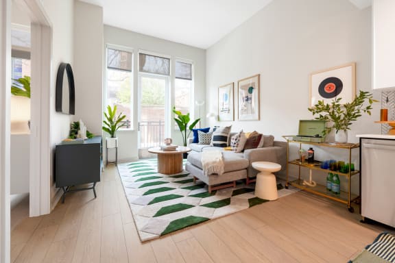 a living room with a couch and a rug