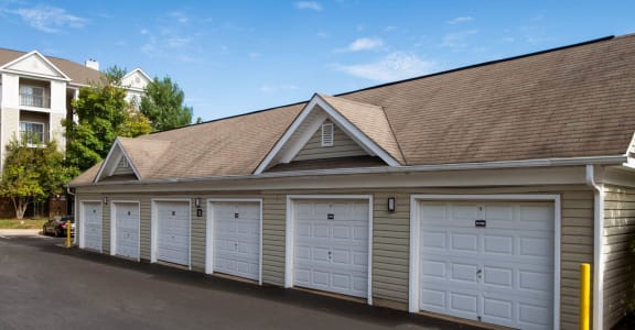 a garage with a row of white garage doors