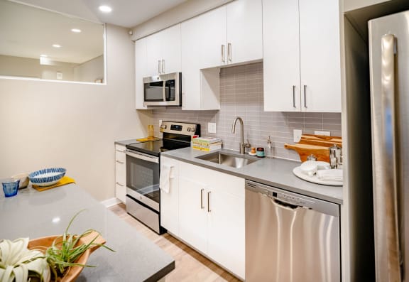 Kitchen with white cabinets and stainless steel appliances