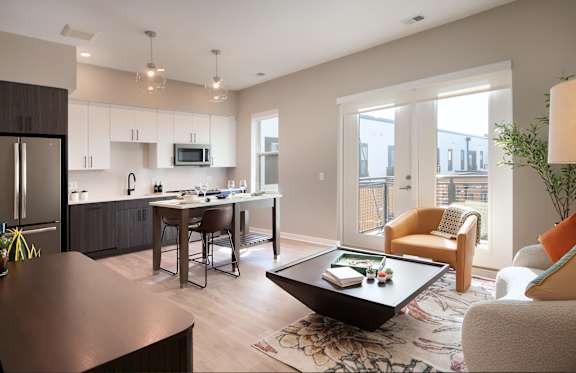 a living room with a kitchen and a dining room
