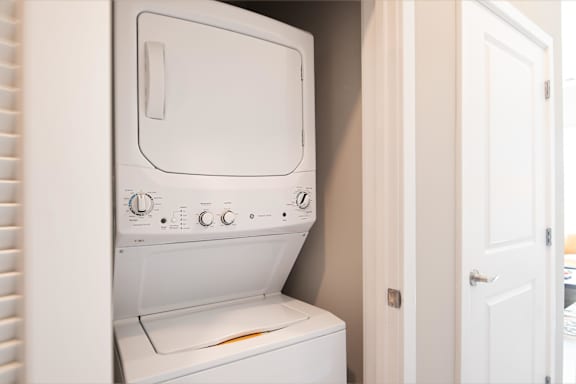 a washer and dryer in a small laundry room