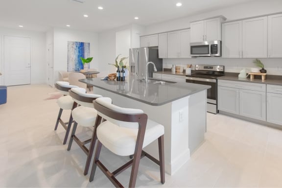 Kitchen with white cabinets at Fiore Townhomes, Venice