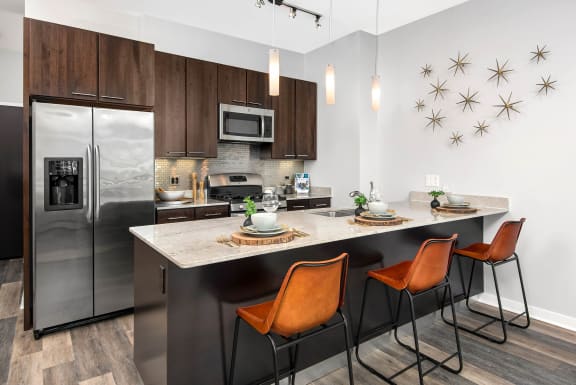 kitchen with stainless steel appliances at the central apartments near downtown minneapolis mn 55408
