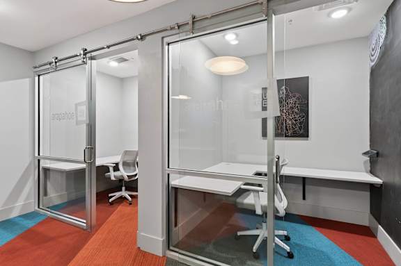A glass wall divides a room in half.