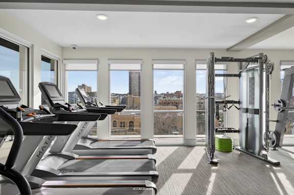Modern apartment fitness center with cardio and strength equipment in Denver.