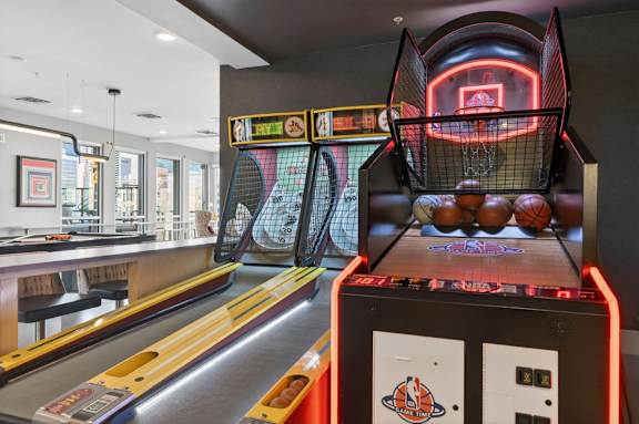 Indoor game room with tables and recreational space.