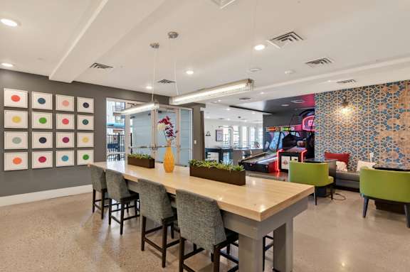 Indoor game room with tables and recreational space.