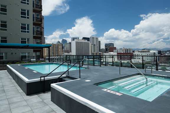 Pool with views of the Denver skyline.