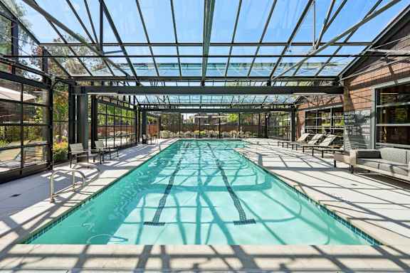 A long rectangular pool with a glass ceiling.