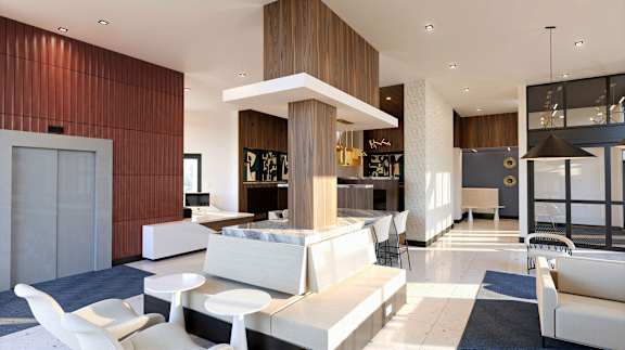 A modern living room with a white sofa set and a wooden accent wall.