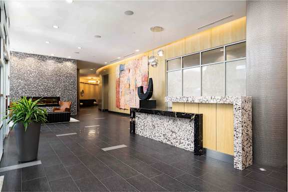 the lobby of a hotel with a reception desk