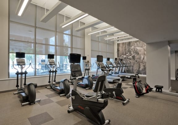 a gym with a bunch of exercise equipment in it