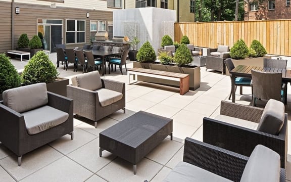 a patio with chairs and tables on a patio
