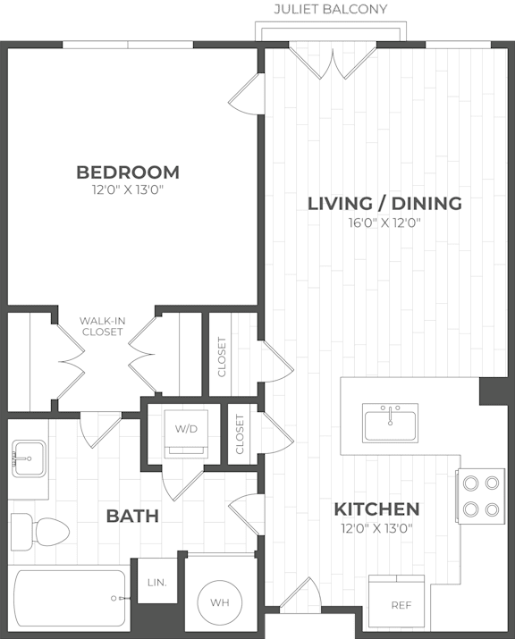 A floor plan of a small apartment with a bedroom, living/dining area, kitchen, and bathroom.