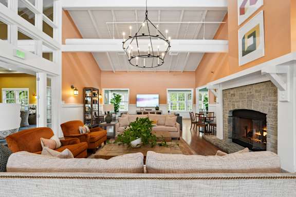 A living room with a fireplace and a couch.