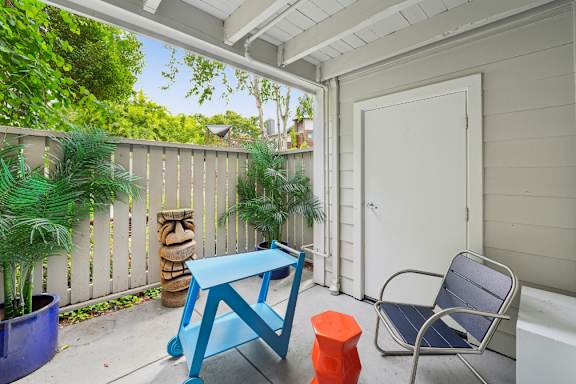 A blue table and chair set on a patio.