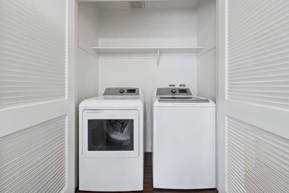 Two white appliances in a small kitchen.