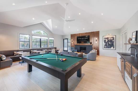 a pool table in the middle of a living room