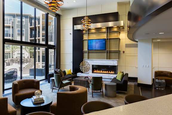 A modern living room with a fireplace and a television.
