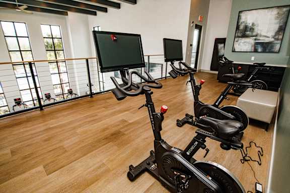 Peloton bikes in cycling room at The Crossing at Palm Aire