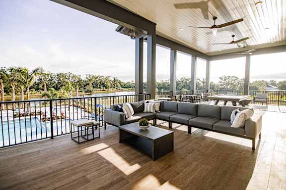 A modern living room with a view of the outdoors.