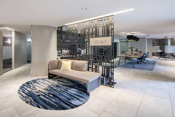 A modern office space with a white and black color scheme.