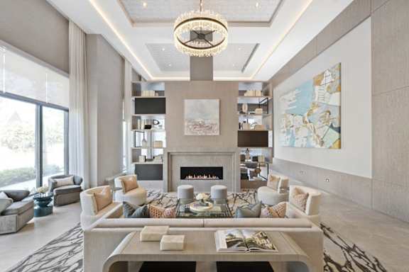 A modern living room with a fireplace and a chandelier.