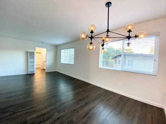 Stunning Living Room with Hardwood Floors, Modern Lighting, and Large Window at 2120 Valerga in Belmont, 94002