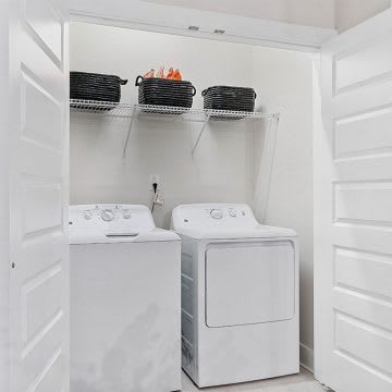A white laundry room with a washer and dryer.at 198 Milltown Apartments, Burlington, NC 27215