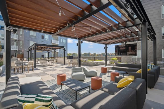 Outdoor TV lounge at The Hallon luxury apartments in Hopkins, MN