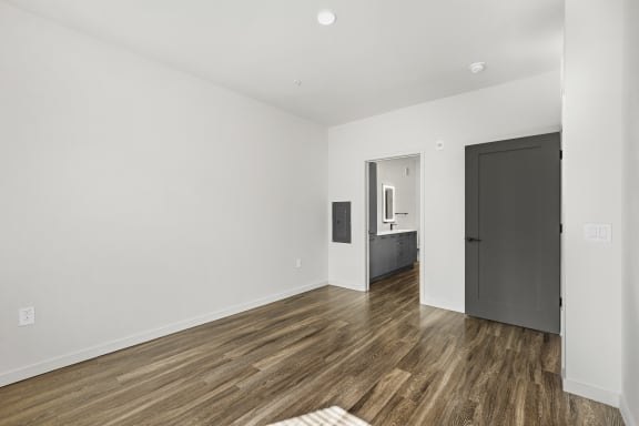 Bedroom apartment with wood floors and en suite bathroom at Azalea, Luxury Tampa Apartments