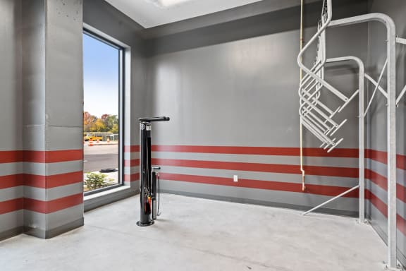the lobby of a building with a fire hydrant and a ladder on the wall