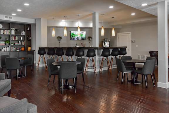 A room with a long table and chairs.