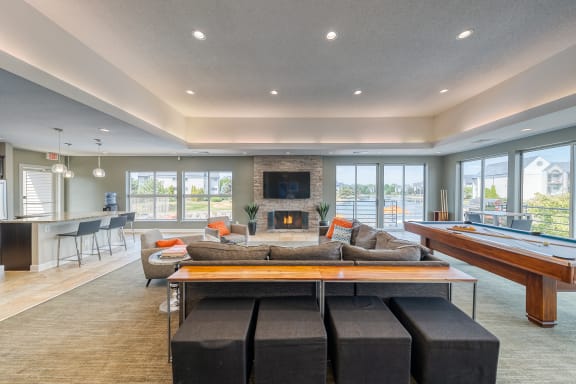 Clubroom With Smart Tv And Fireplace at Waterchase Apartments, Michigan