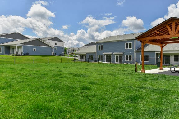 a large yard with houses in the background at The Lodge at Overland, Rochester, Minnesota