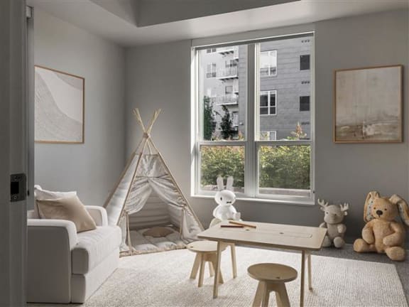 a living room with a teepee and toys