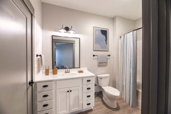 a bathroom with a white sink at The Commons at Rivertown, Michigan, 49418