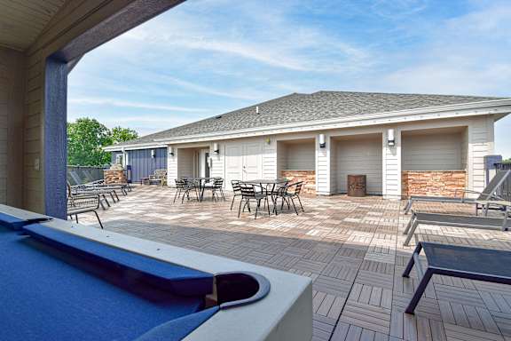 A pool table is in the foreground of this image.