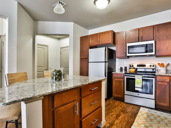 Dining and kitchen attached at Residences at The Streets of St. Charles in St. Charles, MO