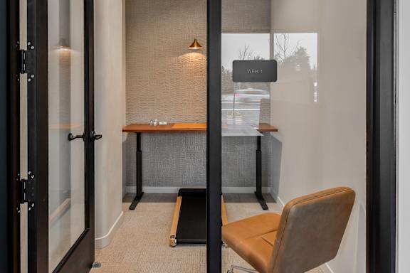 A room with a desk and a chair.