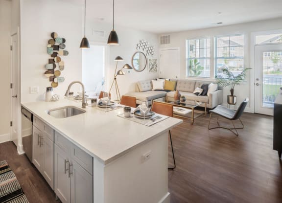 A modern kitchen with a white countertop and a sink at Parc at Princeton Junction Apartments, New Jersey