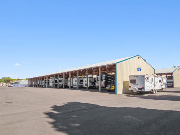 a large building with trucks parked outside of it