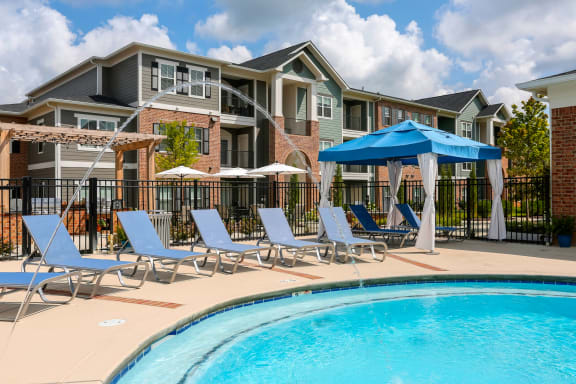 blue pool loungers and private cabana on pool deck at Annandale Apartment Homes, Murfreesboro, TN