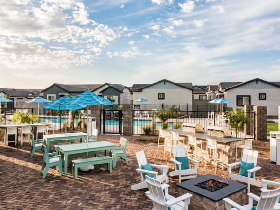 A patio with a fire pit and chairs at Onyx at Westgate Apartments, Glendale, AZ, 85305